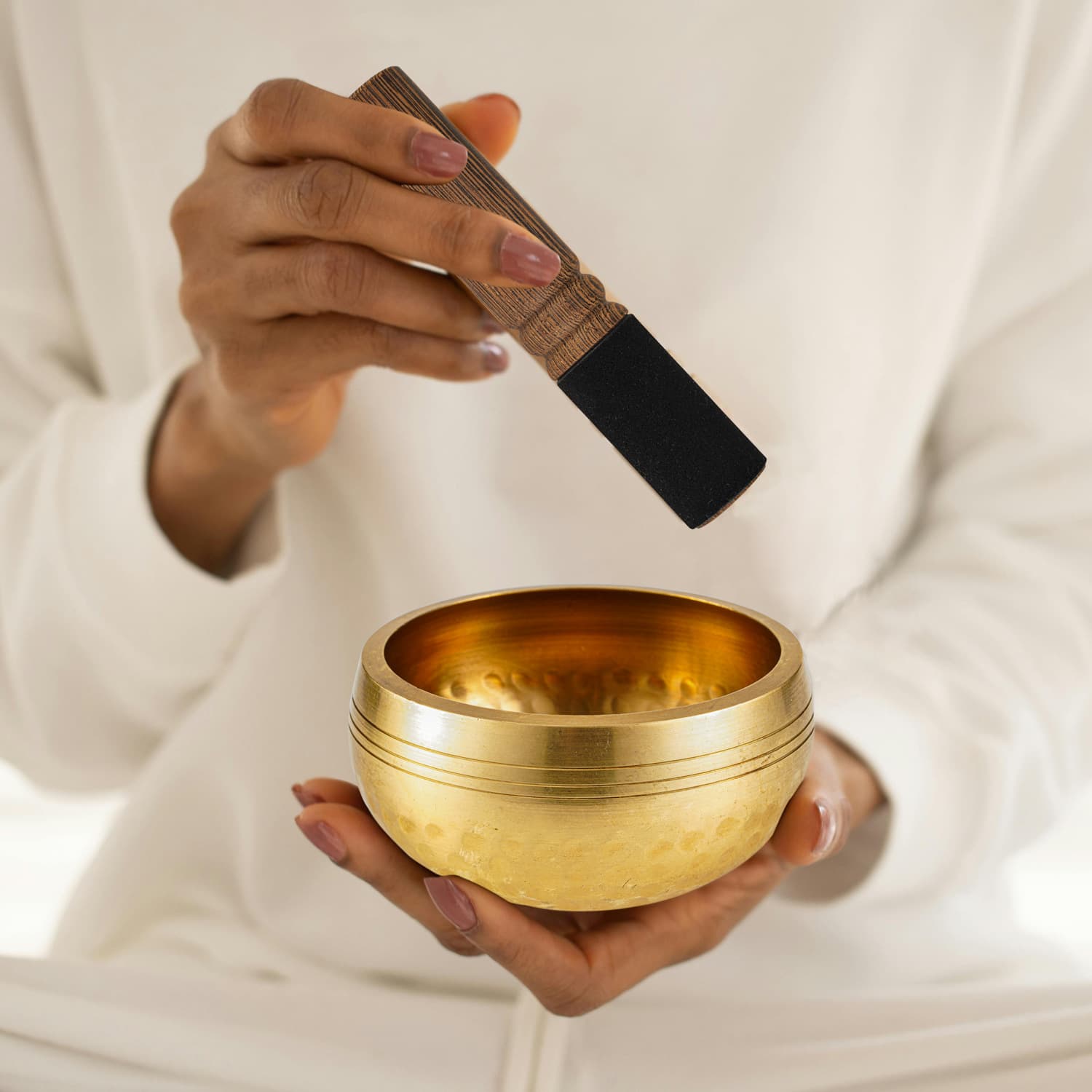 Hand-hammered Nepalese brass singing bowl with wooden mallet and cushion