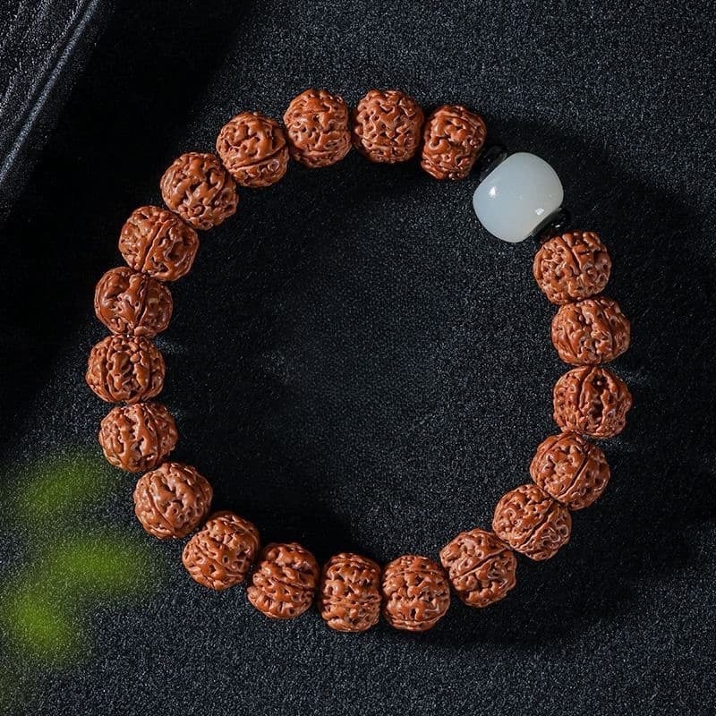 Rudraksha Bodhi bracelet with white accent bead on dark stone