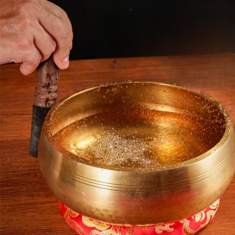 Nepalese brass singing bowl viewed from above showing hand-hammered interior